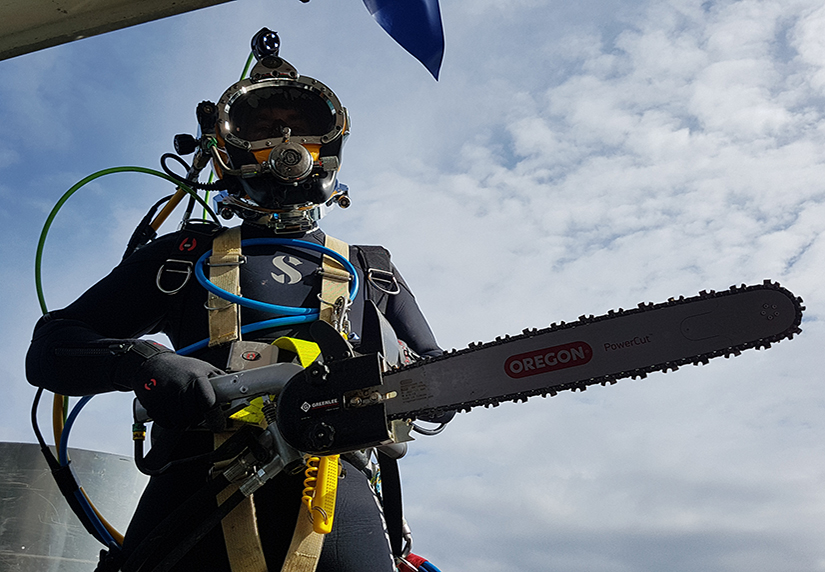 PDTA student holding chainsaw