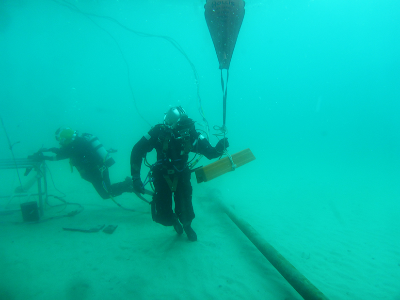 occupational diving student completing pipeline task