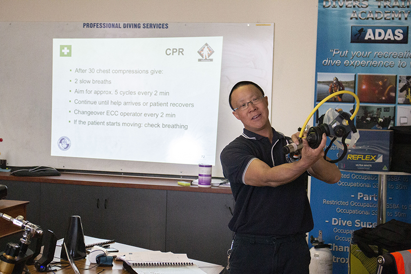 Johnny Lau CPR training with dive mask