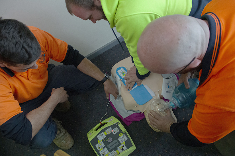 Students undertaking defibrillator training