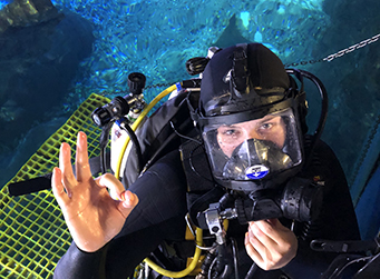 Aquarium diver preparing for a dive