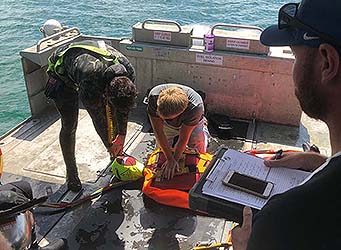 Diving Supervisor student in emergency dive scenario