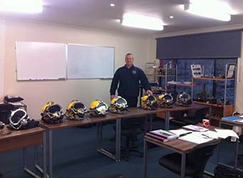 Diving technician trainer with helmets