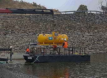 Hyperbaric chamber being loaded onto barge